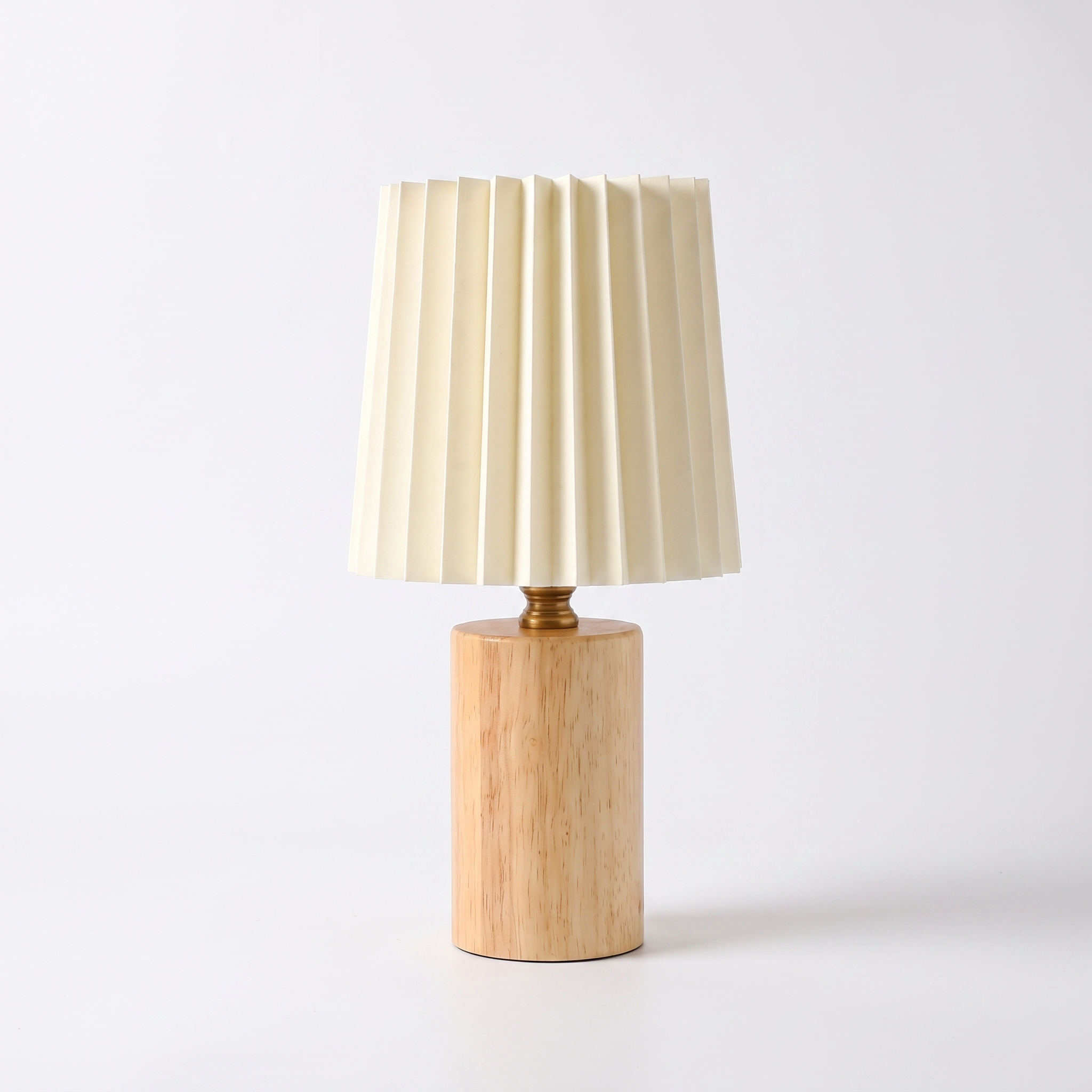 Marlo solid wood pleated-shade table lamp in natural wood on a white background