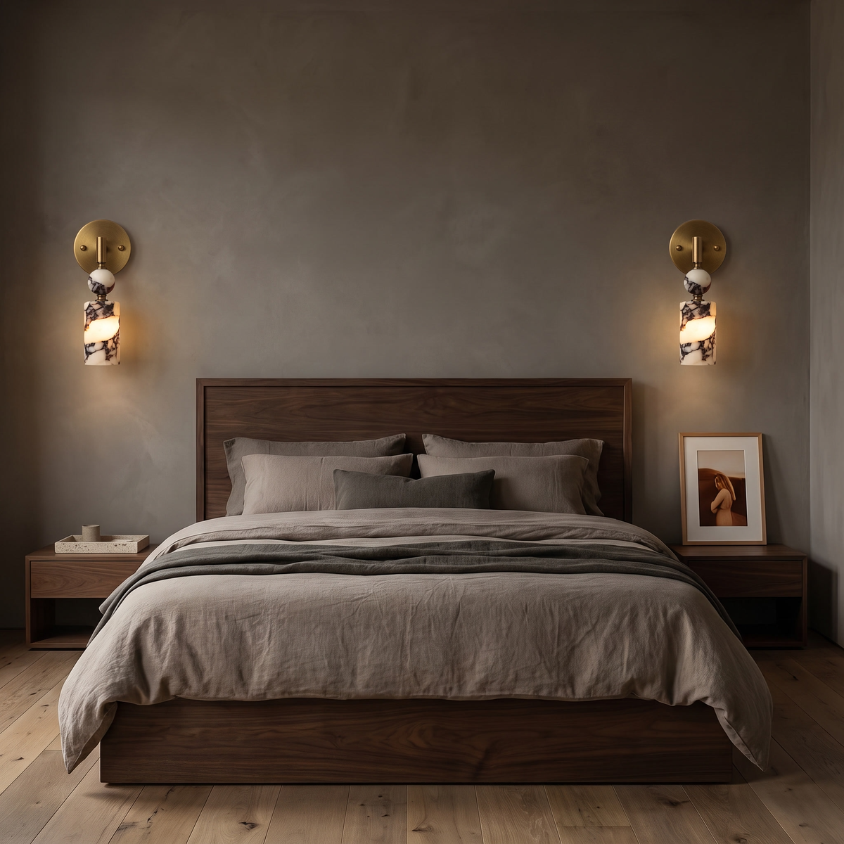 Matteo marble wall light either side of a walnut bed in a moody luxe bedroom