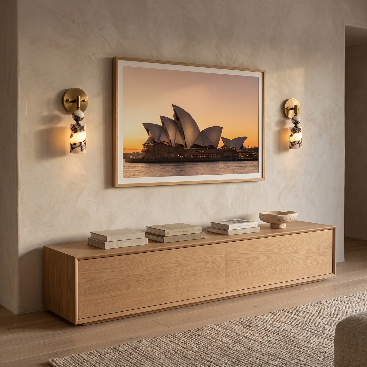 Matteo marble wall light flanking a Sydney Opera House print in a contemporary living room