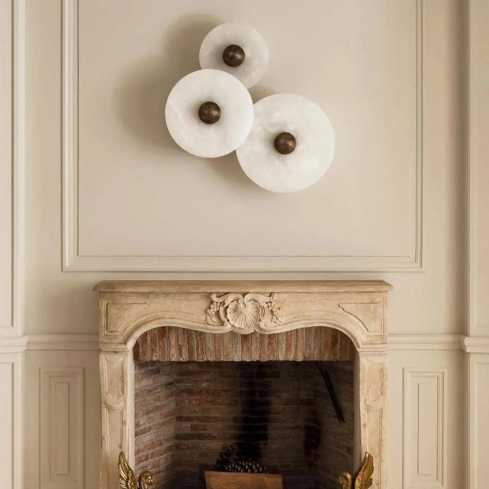Miki round alabaster wall light mounted flush on an interior wall