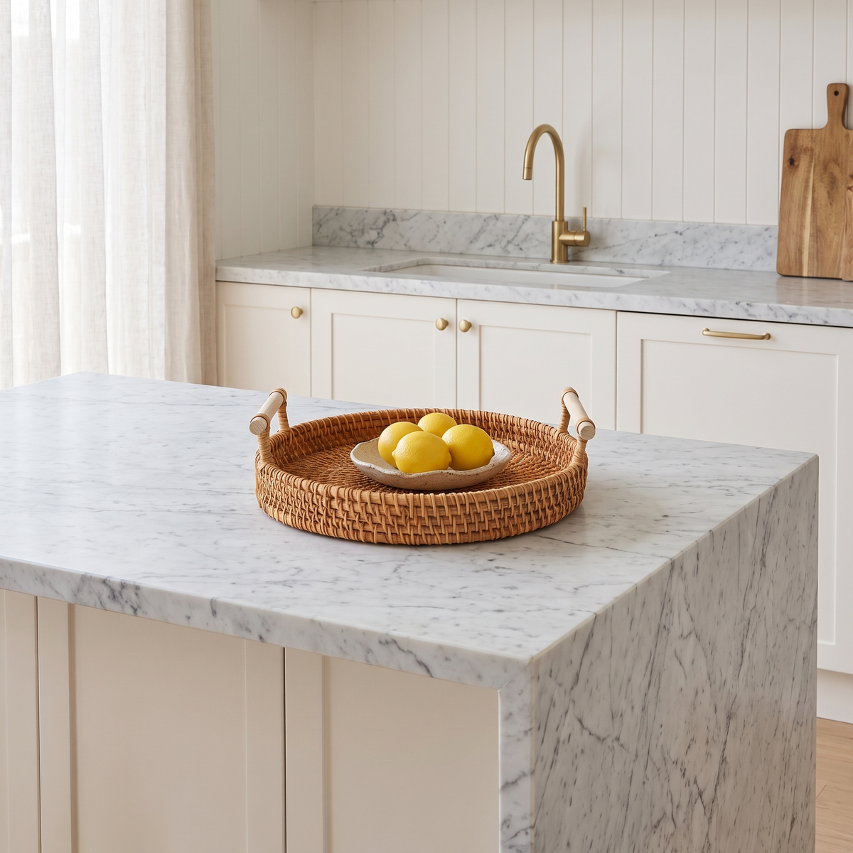 Mila Rustic Rattan Serving Tray on a marble kitchen island bench with fresh lemons