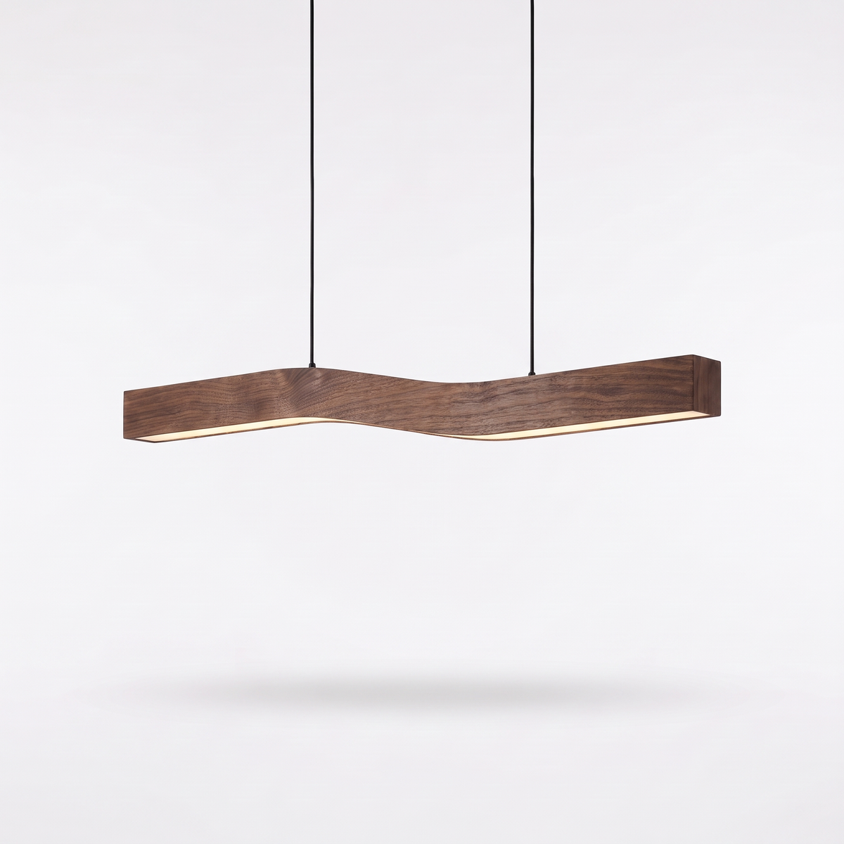 Minna S-curve linear pendant light in dark wood-grain finish on a white background