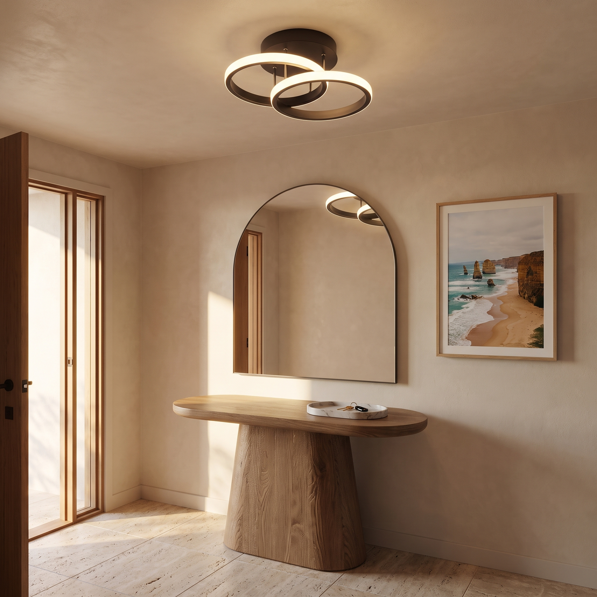 Monni sculptural LED ceiling light in an entry foyer with a rounded timber console and arched mirror