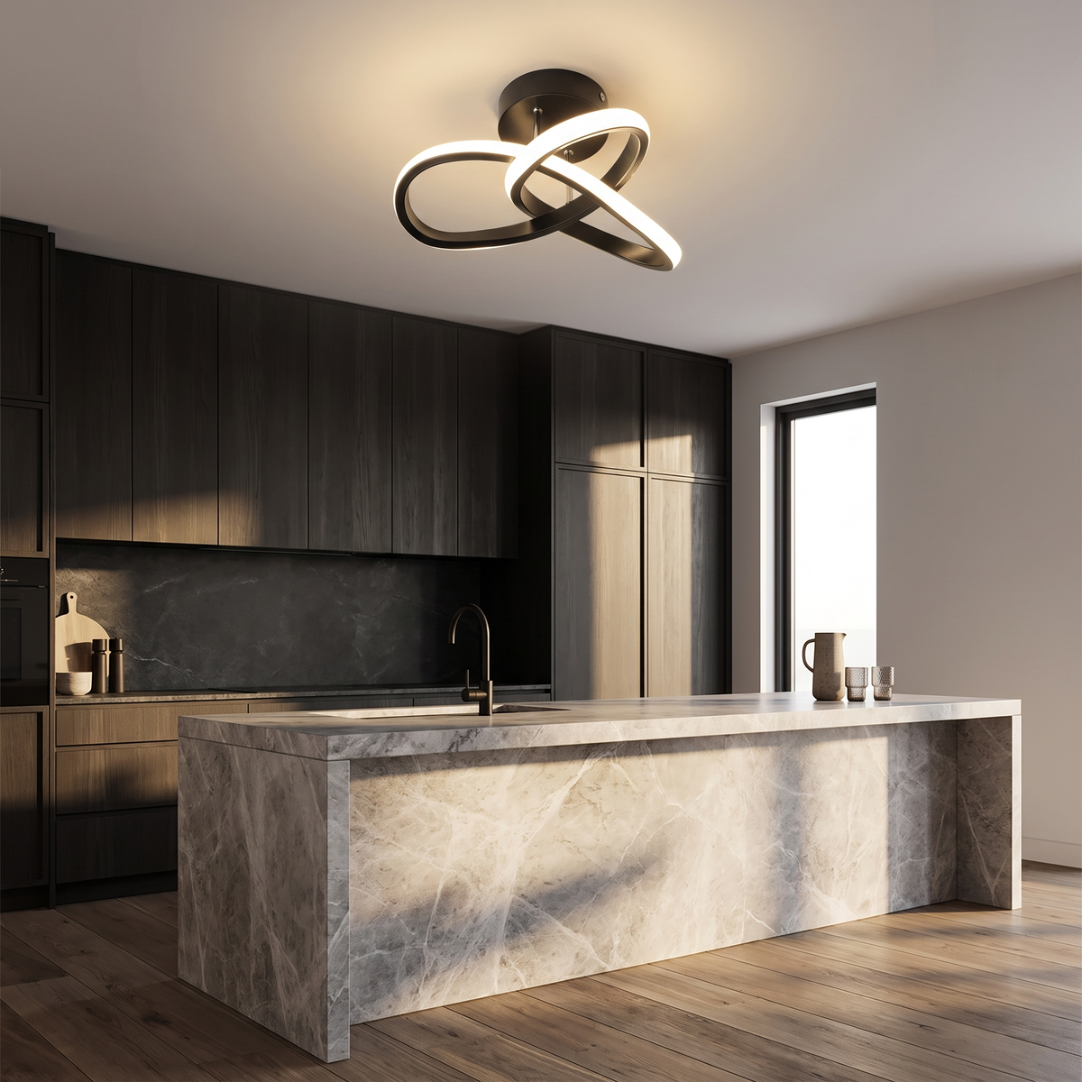 Monni sculptural LED ceiling light in a moody kitchen with dark cabinetry and a marble island