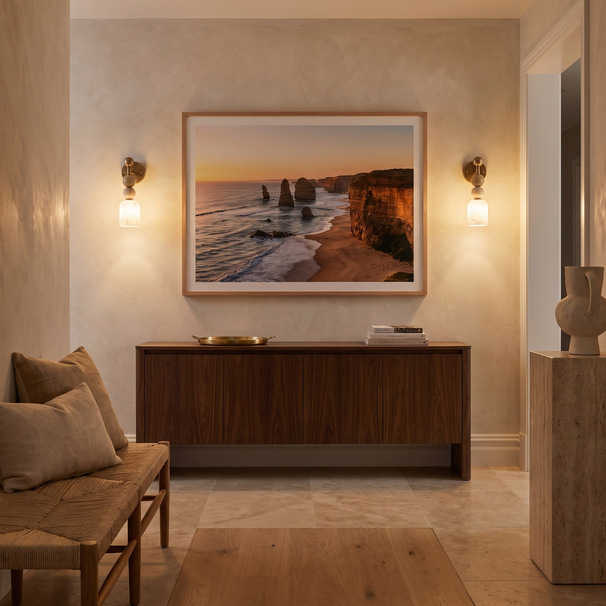 Monti marble bead wall light flanking a timber console in a Toorak entry hall