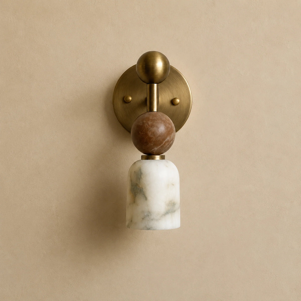 Nalu alabaster wall light showing the brass plate, walnut ball and alabaster shade