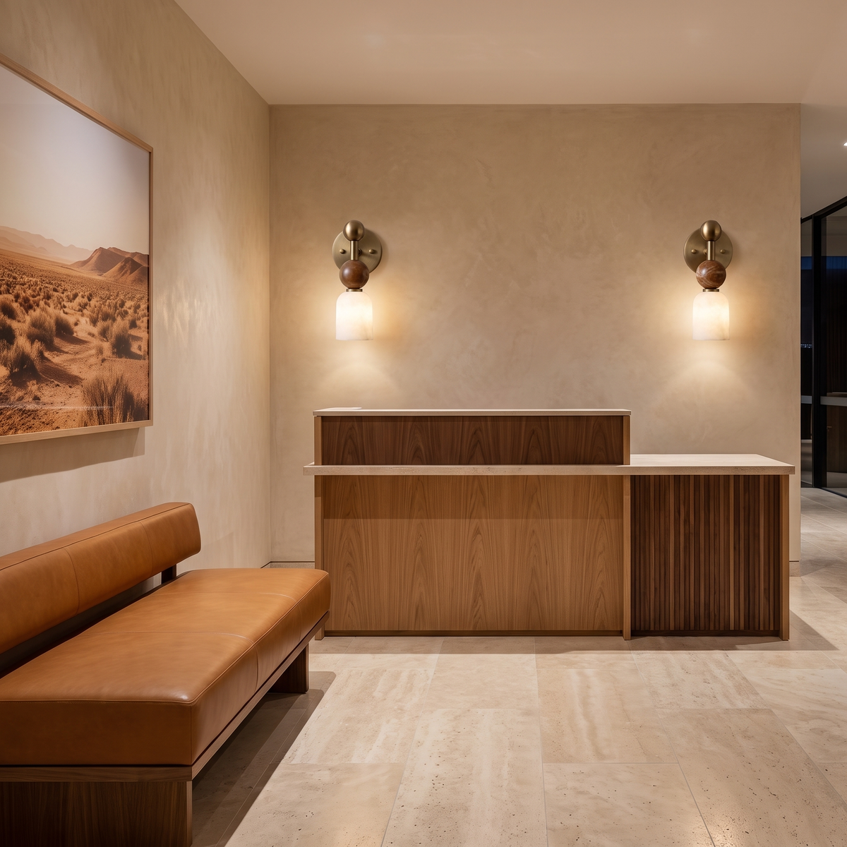 Nalu alabaster wall light flanking a timber reception desk in a boutique hotel lobby