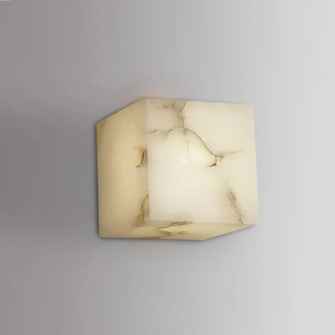 Nova wall lamp shown in a bedroom setting