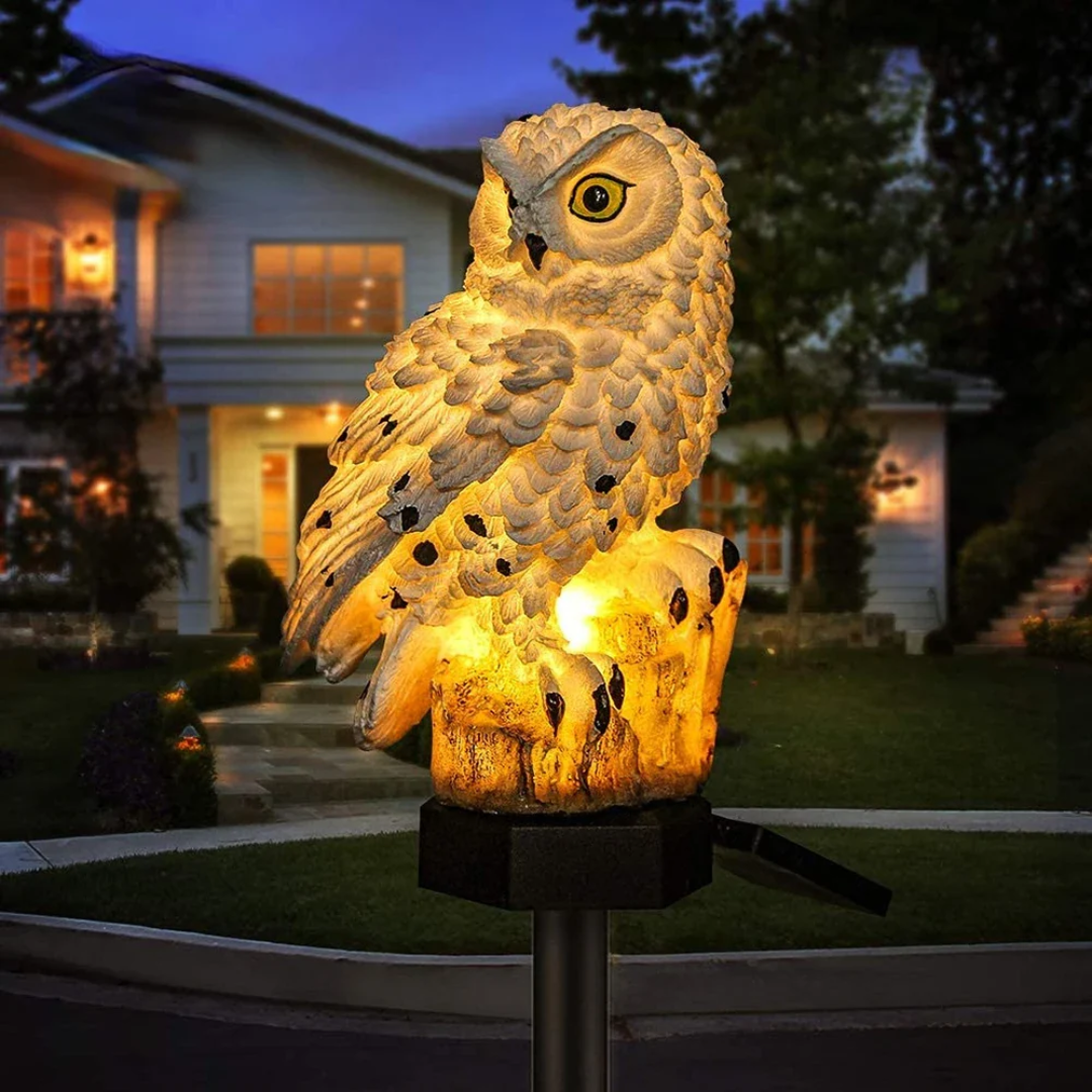 Owl Solar Garden Light displayed in a flower bed