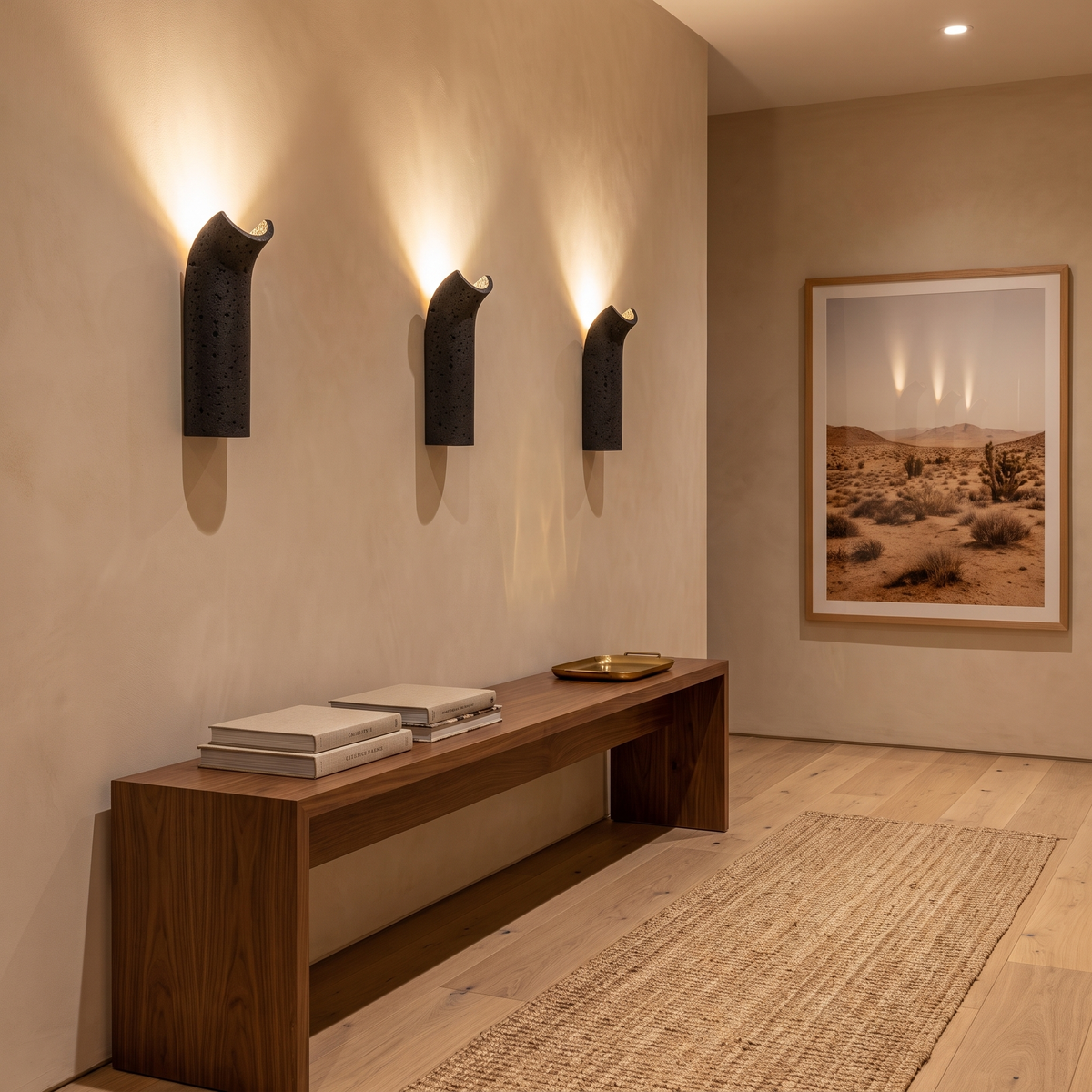 Pasa travertine wall lamp in a row washing warm light up a limewash hallway