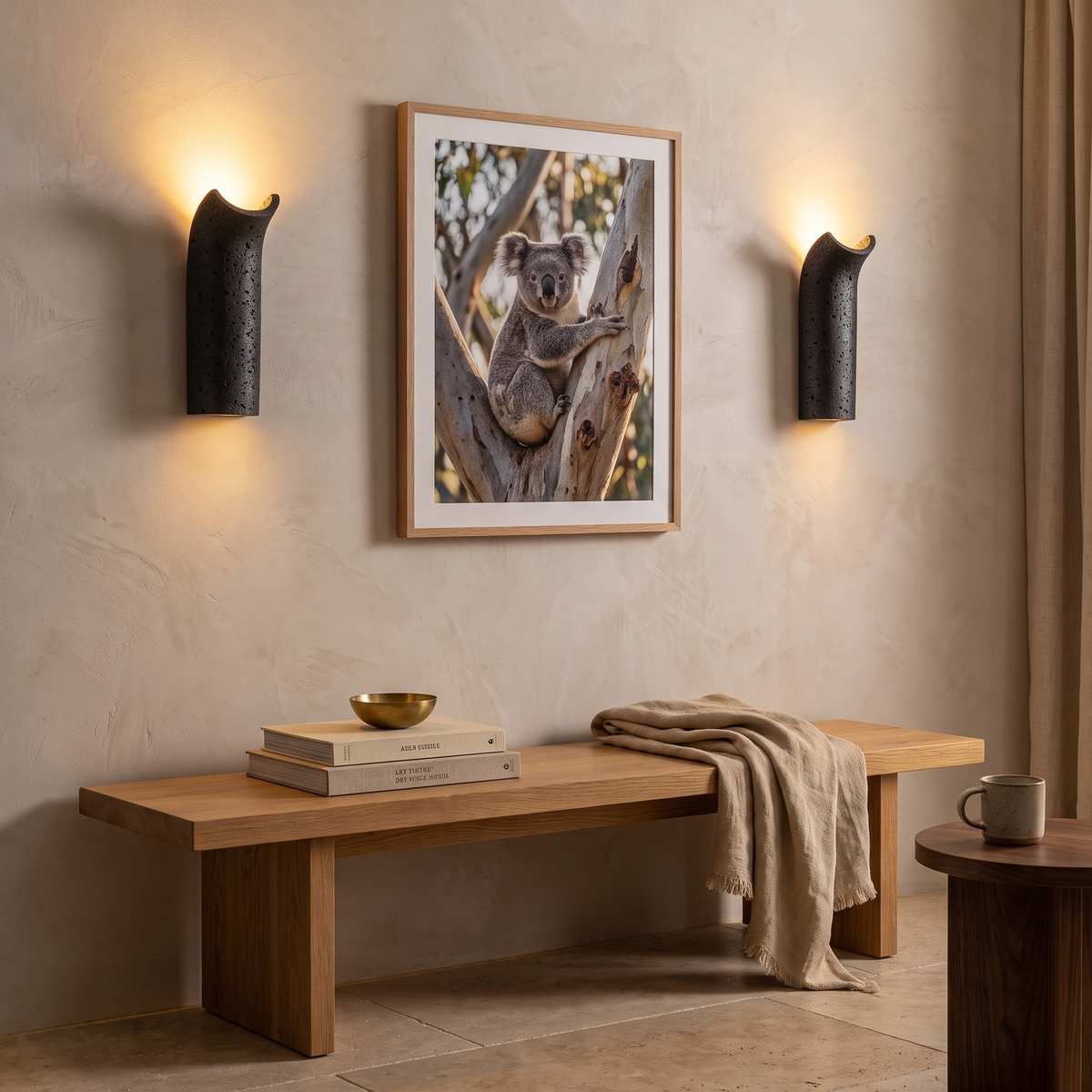 Pasa travertine wall lamp either side of a koala print in a Scandinavian living room