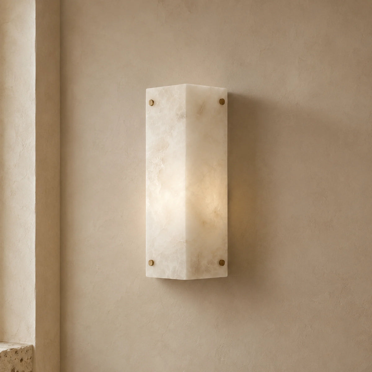 Popi marble wall light Single panel glowing on a plaster wall, showing the marble veining