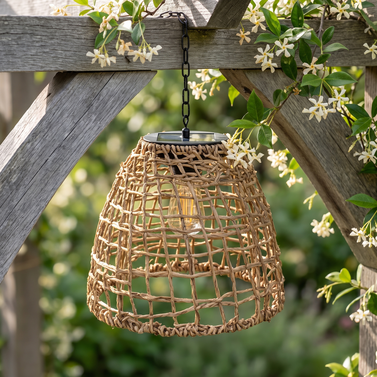 Close-up of the Riley rattan solar lantern weave and black solar cap on a jasmine arbour