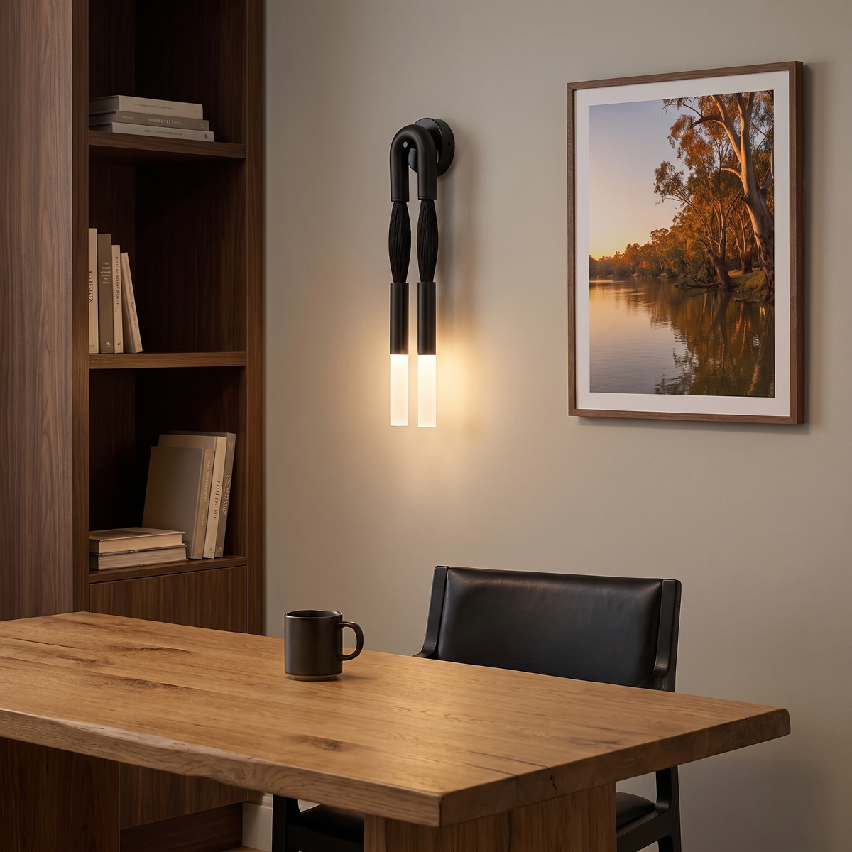 Salin black double wall sconce above a timber desk in a home office