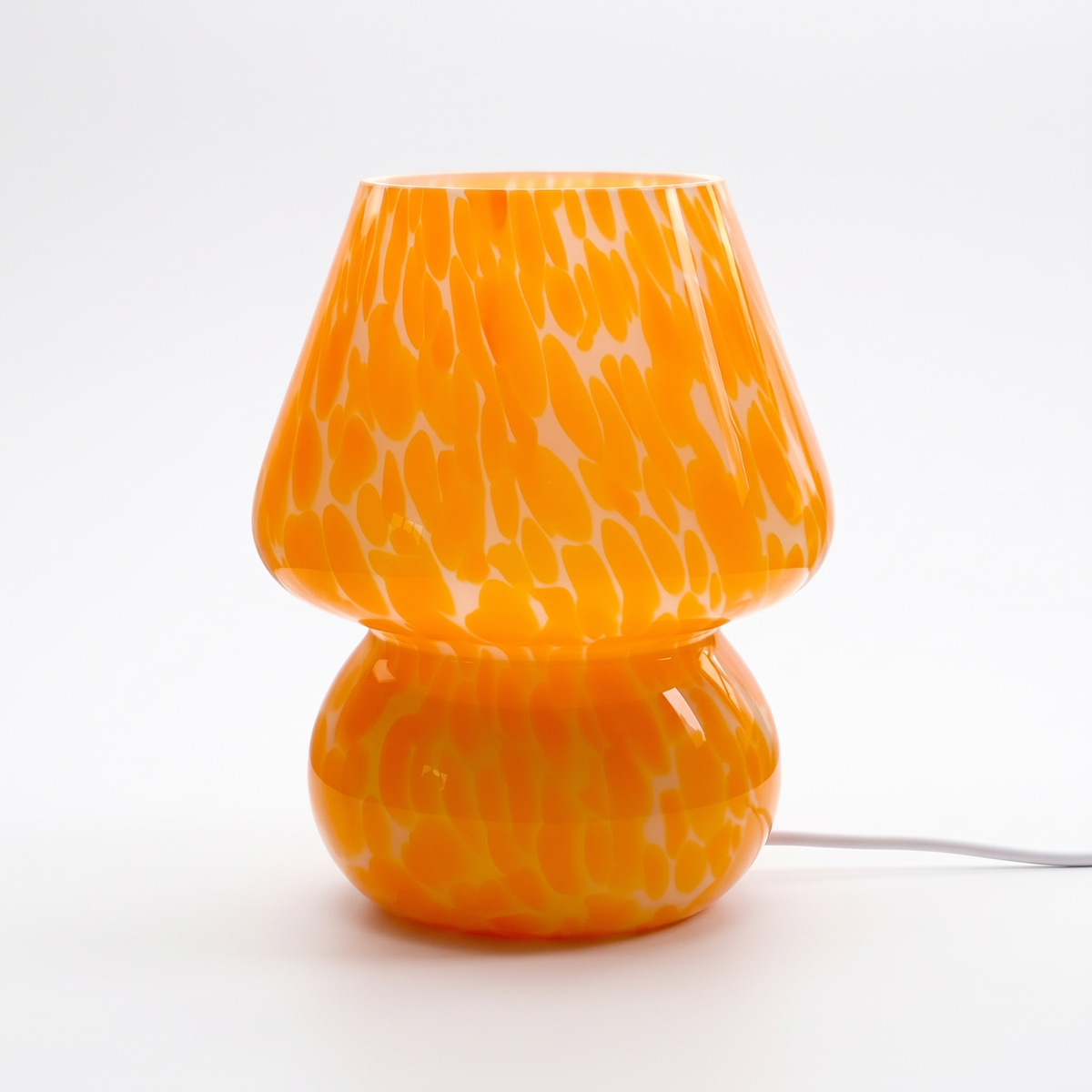 Sargi stained glass mushroom table lamp in orange on a white background