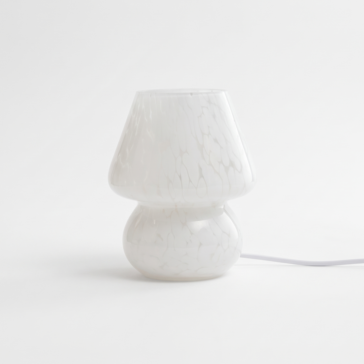 Sargi stained glass mushroom table lamp in white on a white background