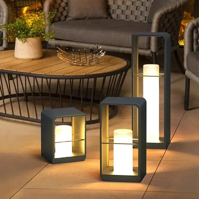 Sari Solar Garden Light illuminated at dusk near a fence