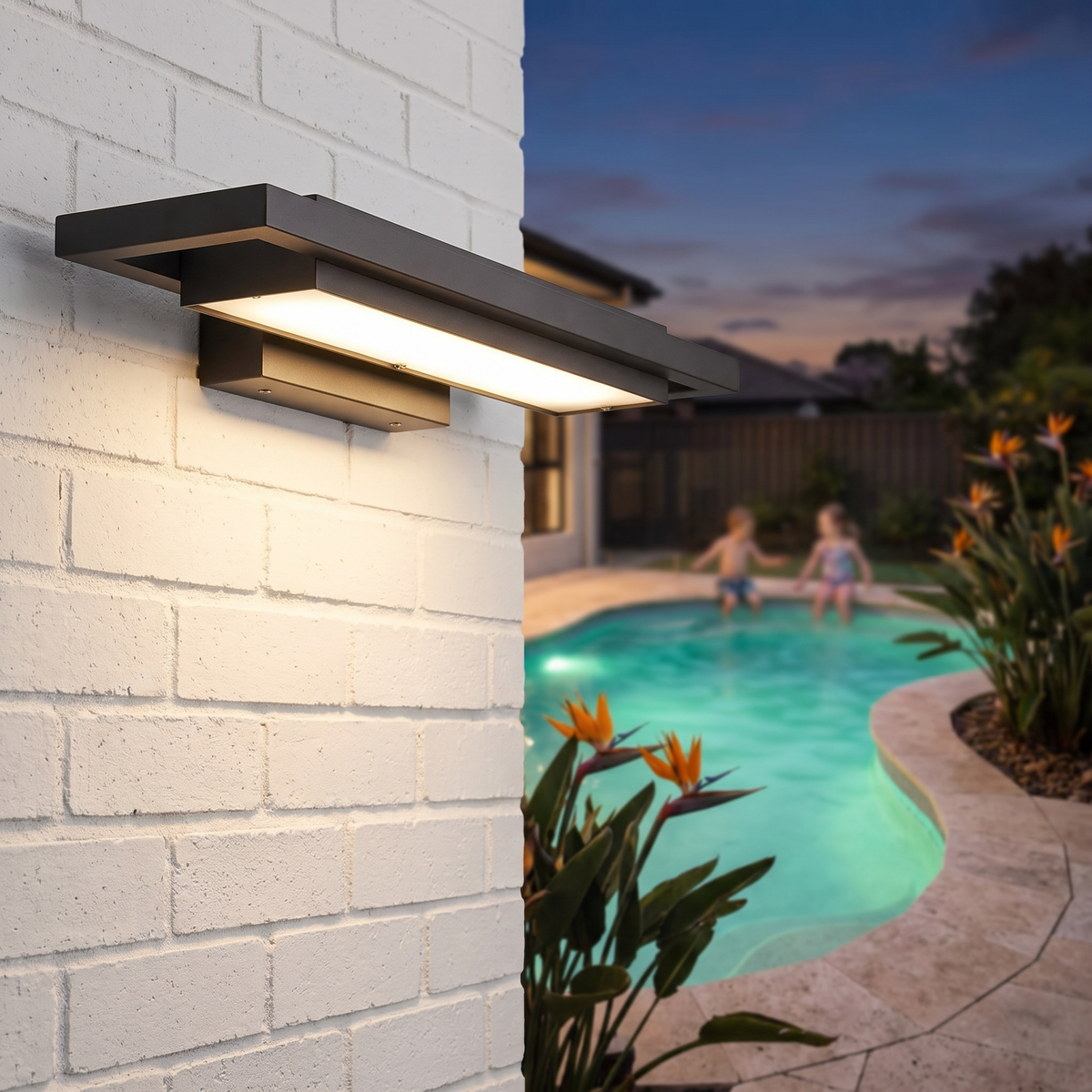Shan outdoor wall light, 55cm, on white brick by an alfresco and pool at dusk