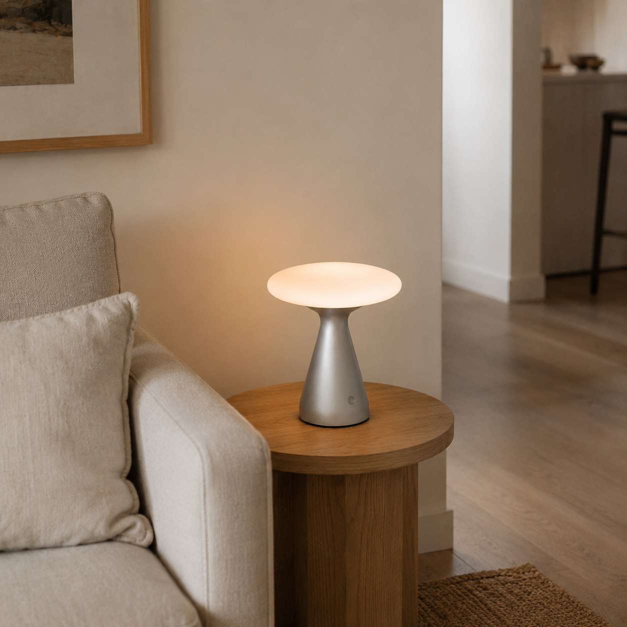 Silvie wireless rechargeable table lamp glowing with warm diffused light