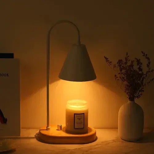 Solara candle warmer lamp glowing with warm ambient light on bedside table
