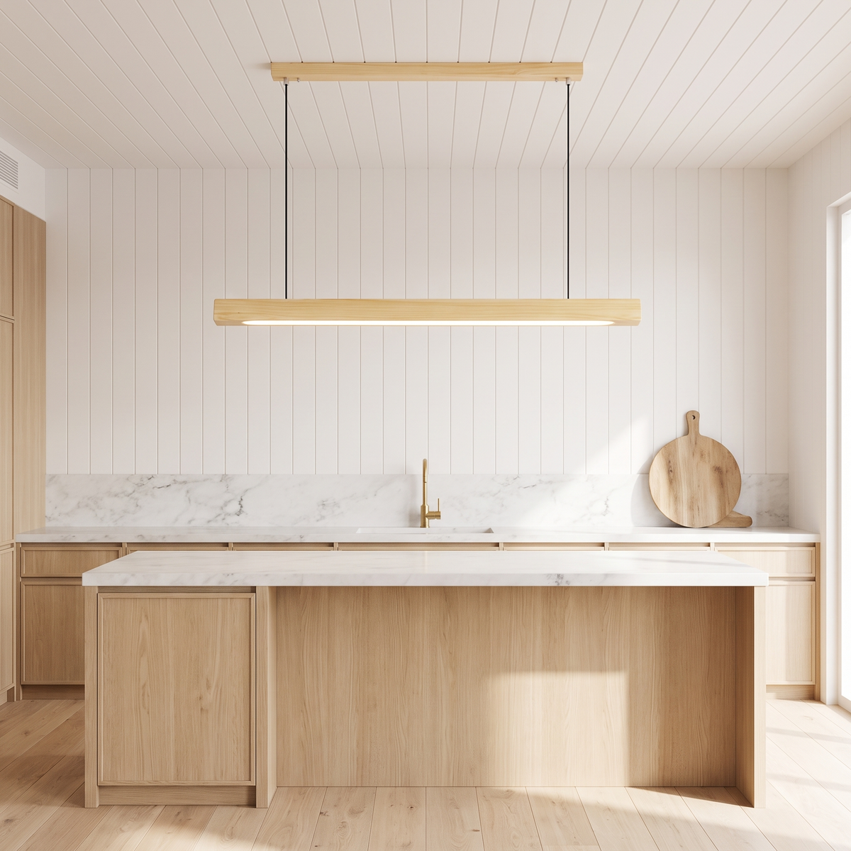 Sorrento pendant light in Pine B with its ceiling rail above a marble island in a coastal kitchen