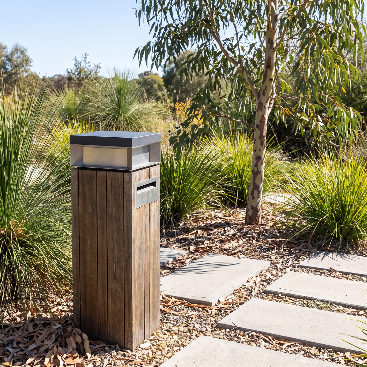 Summer 20cm solar pillar light on a timber letterbox post in daytime