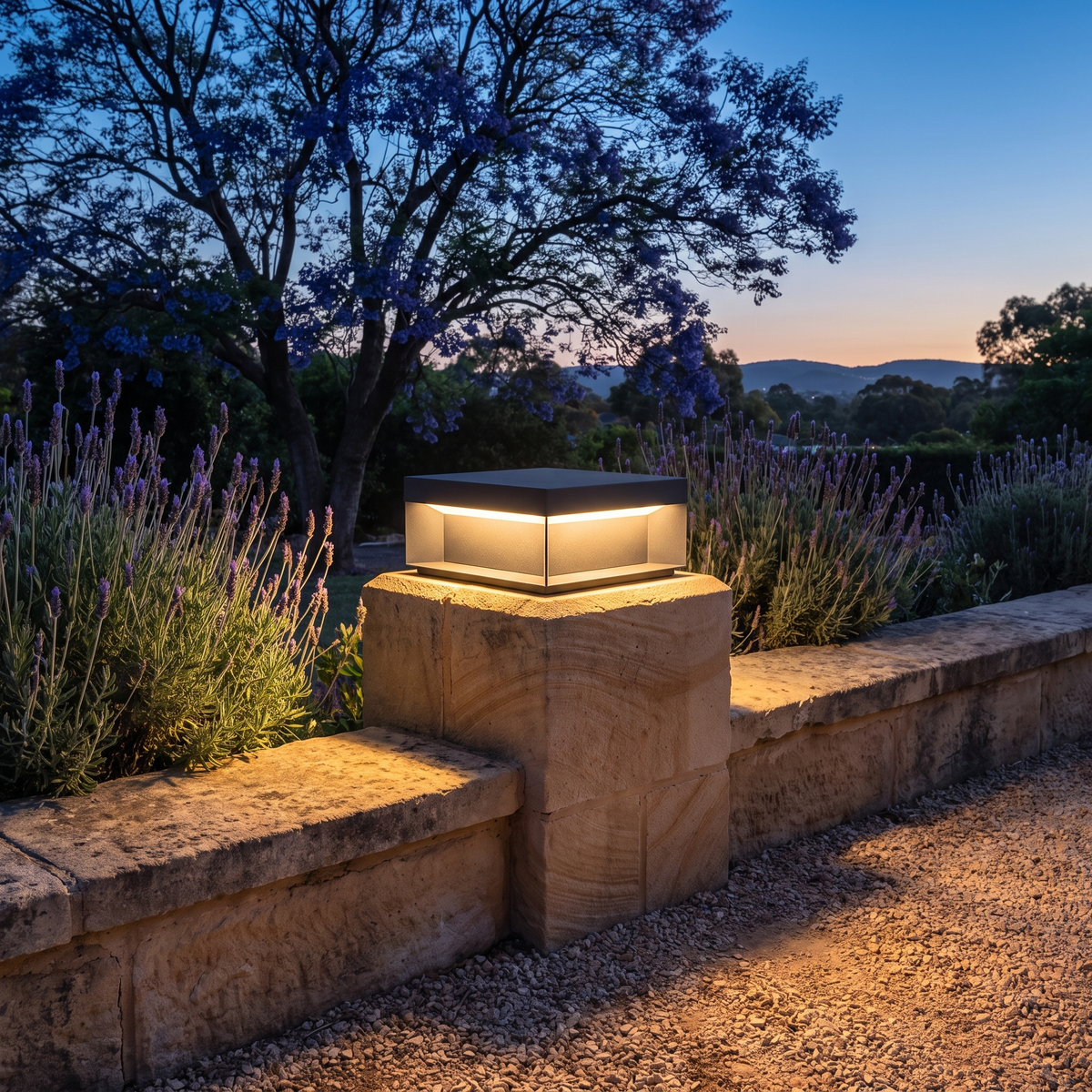 Summer 20cm solar post light on a sandstone garden wall pillar at dusk