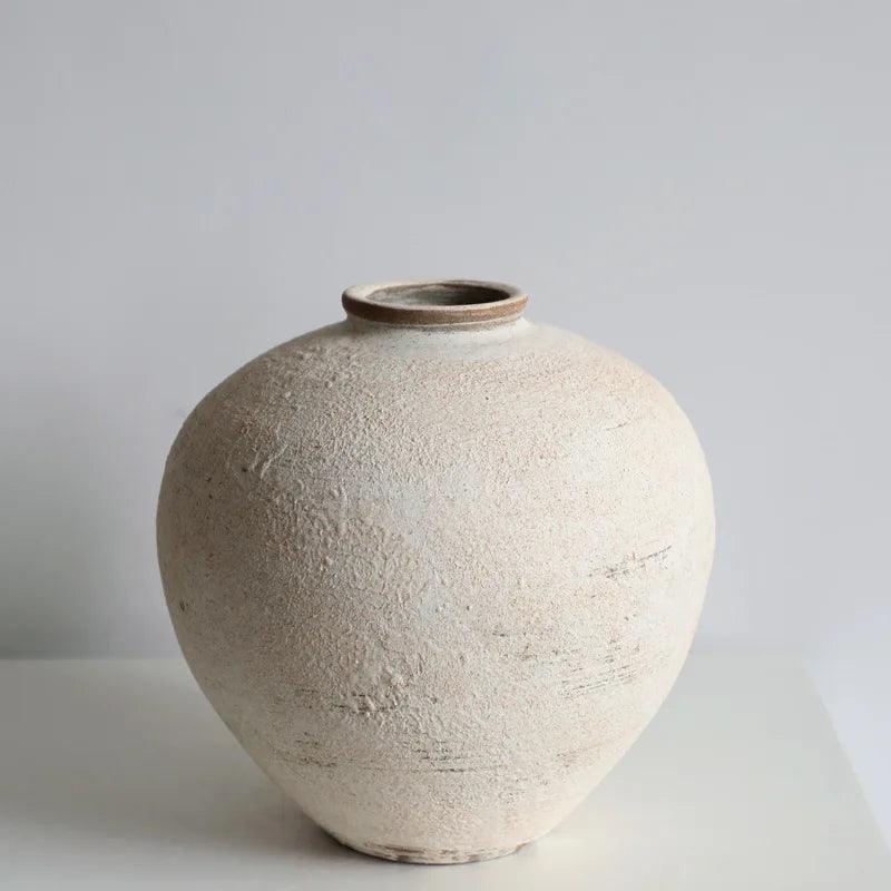 Tama Rustic Clay Vase styled with dried flowers on a console table