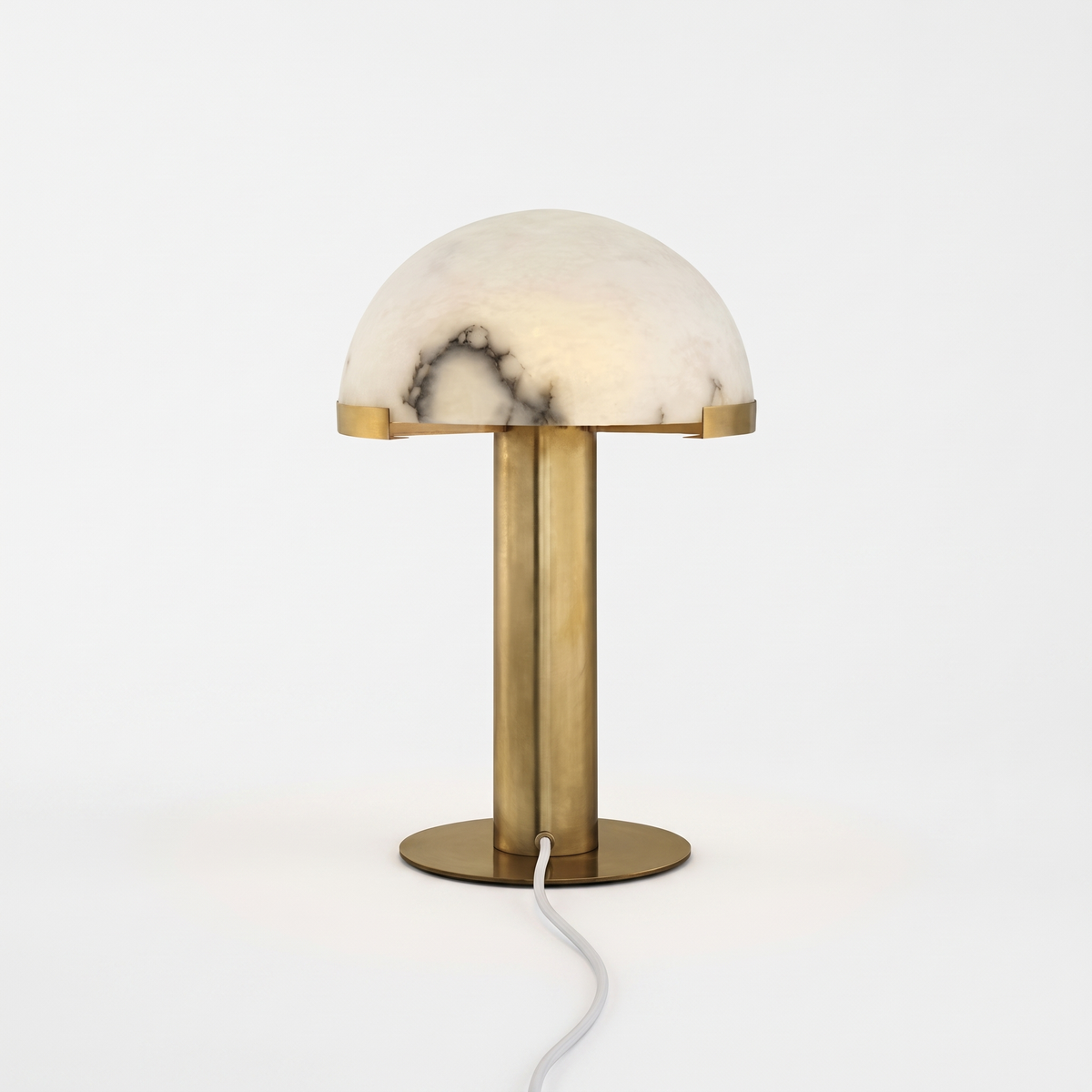 Taya alabaster table lamp with gold bronze base on a white background