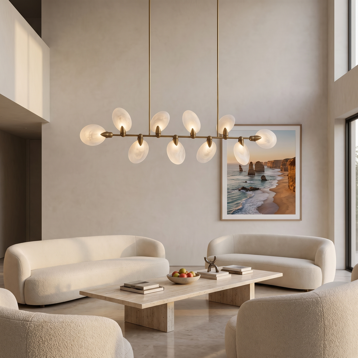 Vale modern chandelier above a travertine coffee table in a double-height hotel lobby lounge