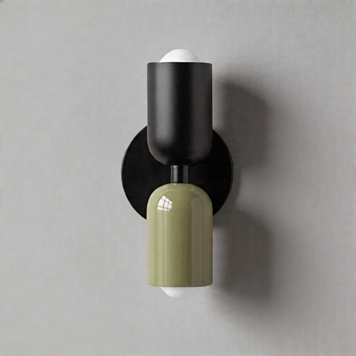 Vic Nordic up down wall sconce with a black wall plate, black upper shade and green lower shade