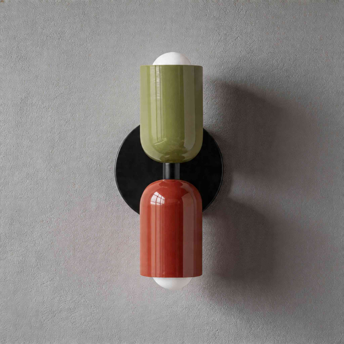 Vic Nordic up down wall sconce with a black wall plate, green upper shade and red lower shade