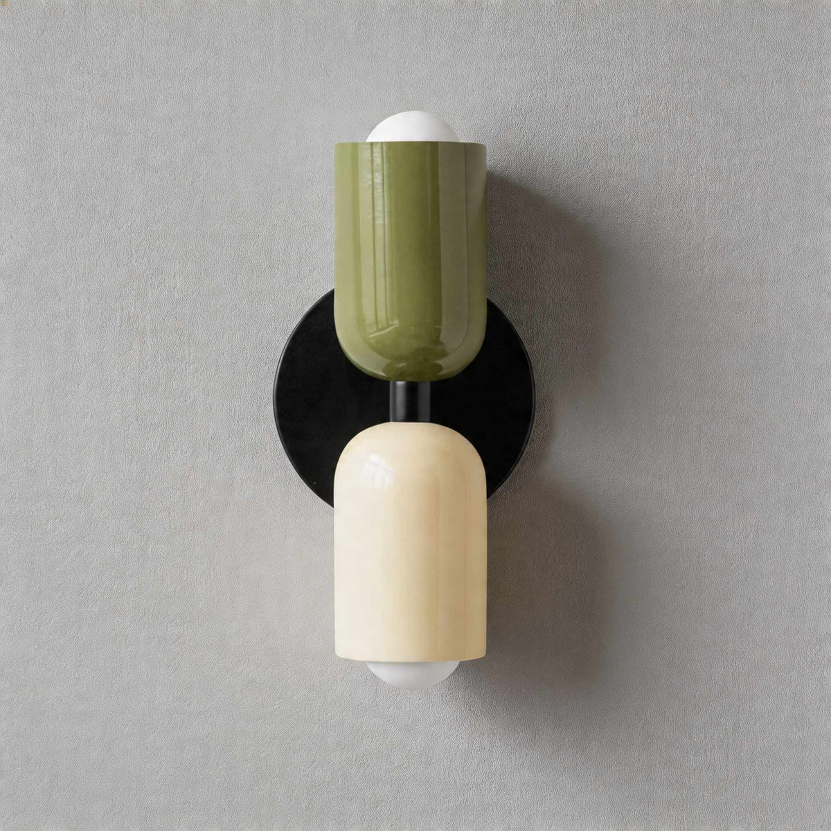 Vic Nordic up down wall sconce with a black wall plate, green upper shade and white lower shade