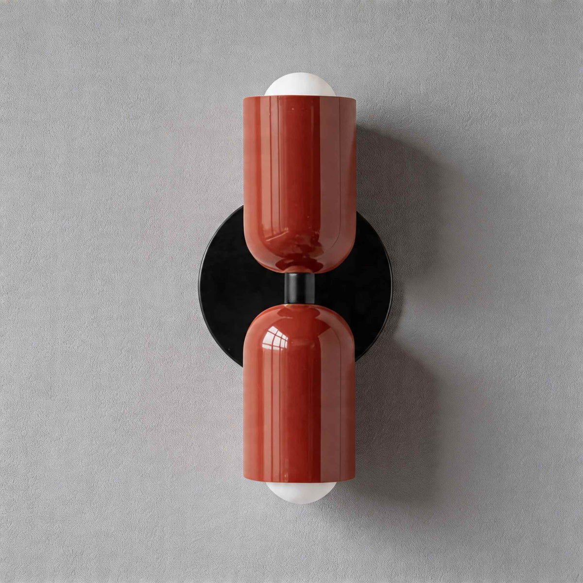 Vic Nordic up down wall sconce with a black wall plate and two red painted iron shades