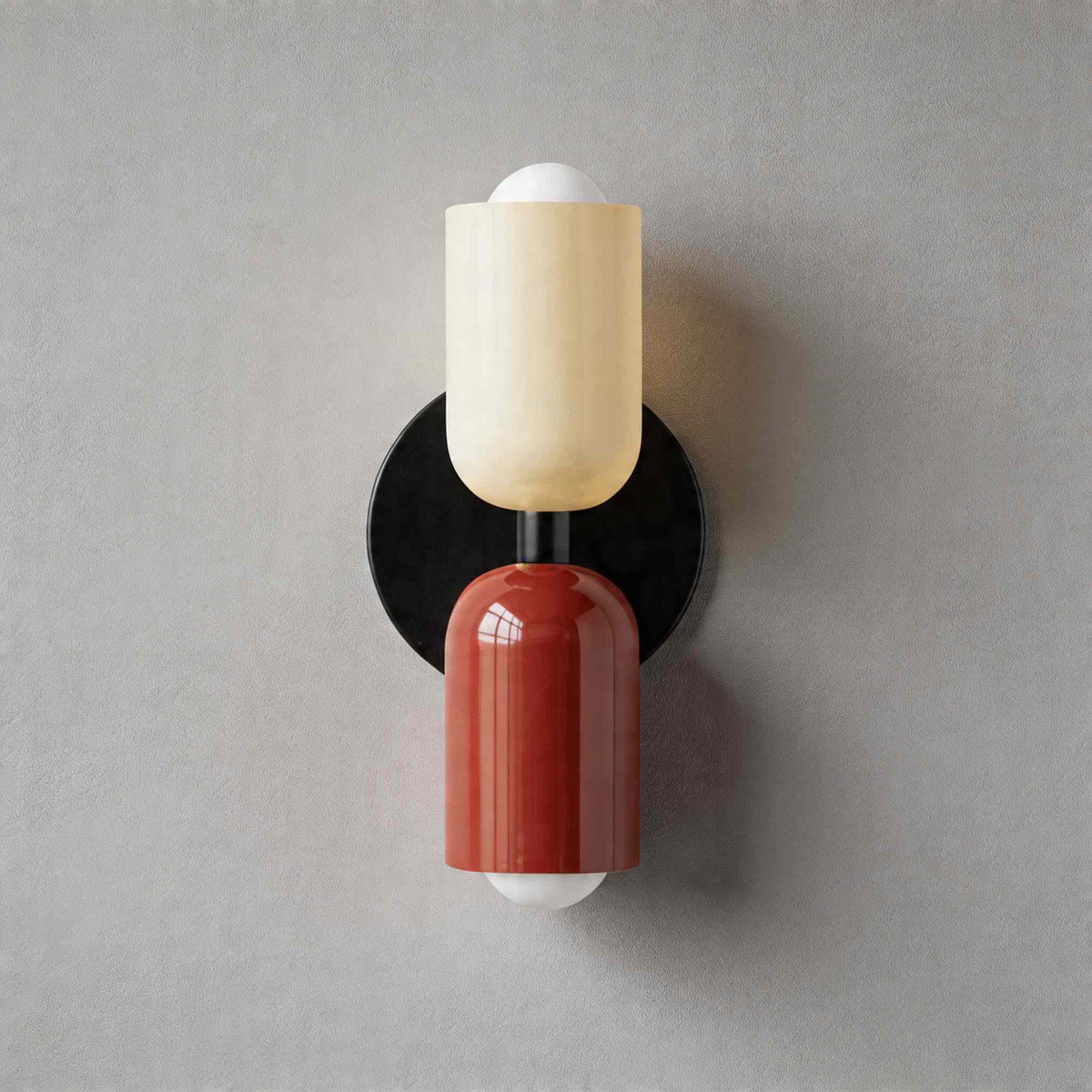 Vic Nordic up down wall sconce with a black wall plate, white upper shade and red lower shade