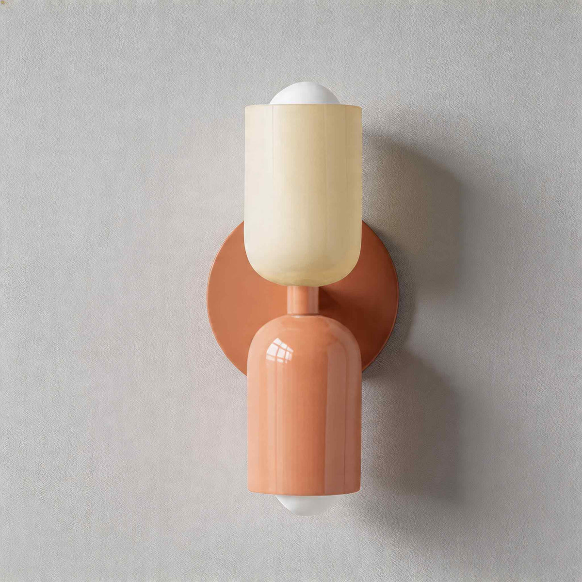 Vic Nordic up down wall sconce with a pink wall plate, white upper shade and pink lower shade