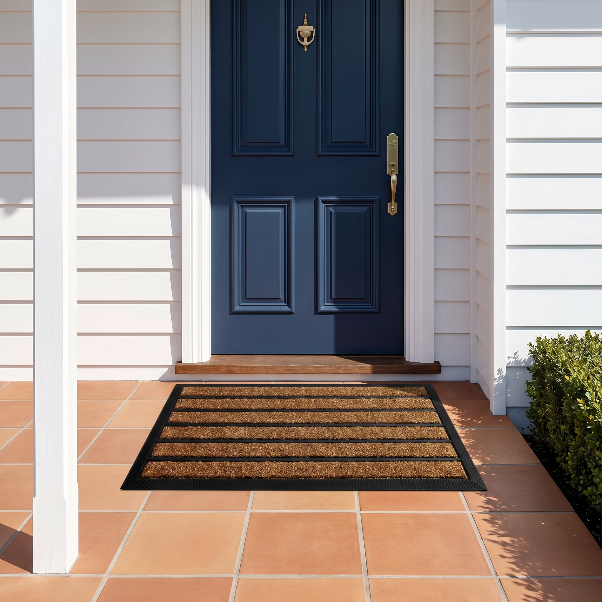 Zara striped doormat on a tiled porch at a white weatherboard beach house front door