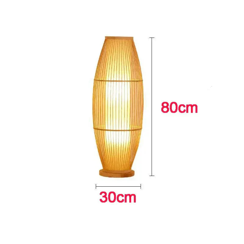Kosci woven bamboo floor lamp with integrated warm-white LED glowing in a modern living room