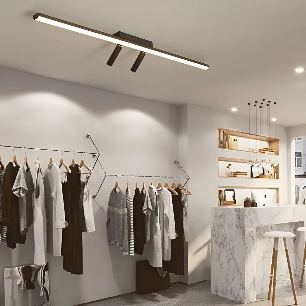 Acanthus Rail Spotlight directing light toward a benchtop