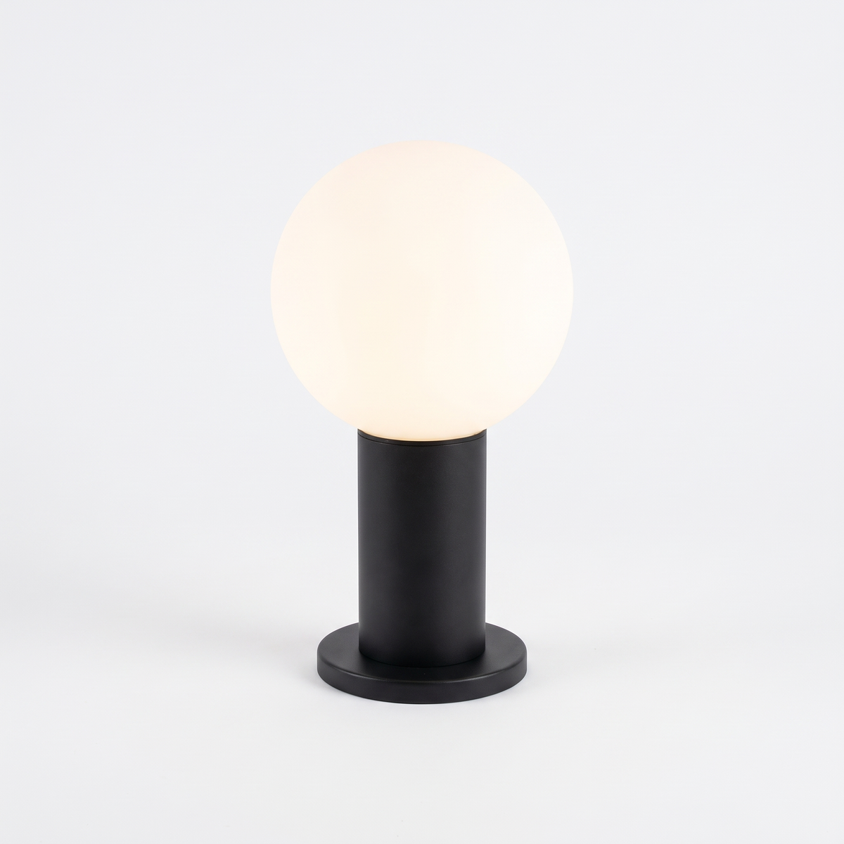 Allen LED bollard light, 25.4cm black post with opal globe and base plate, on a white background