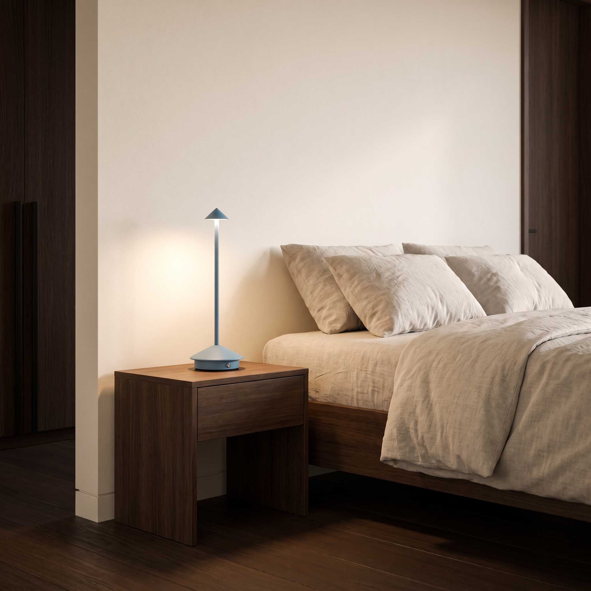Amalfi portable table lamp in blue on a bedside table