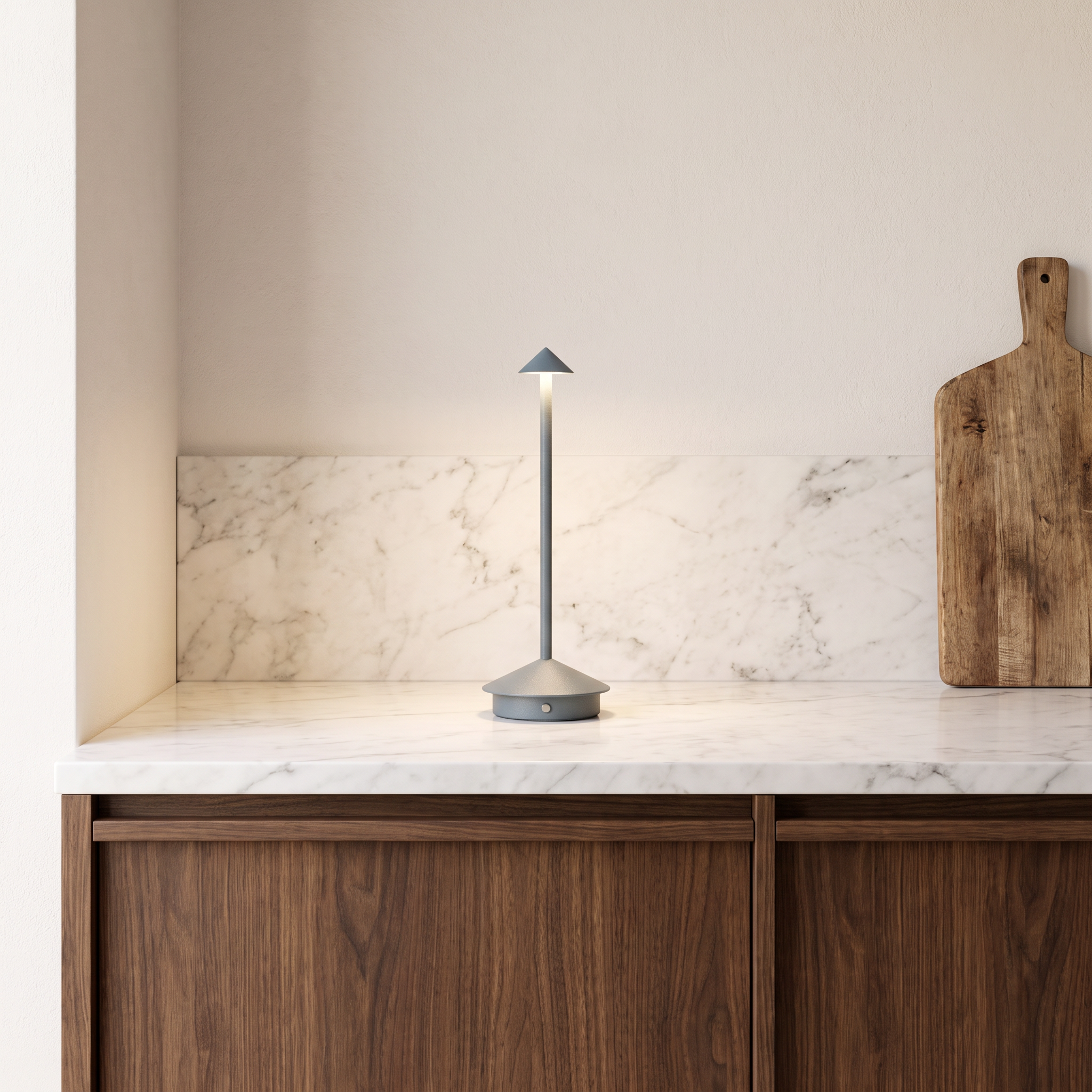 Amalfi portable table lamp in gray on a marble kitchen bench