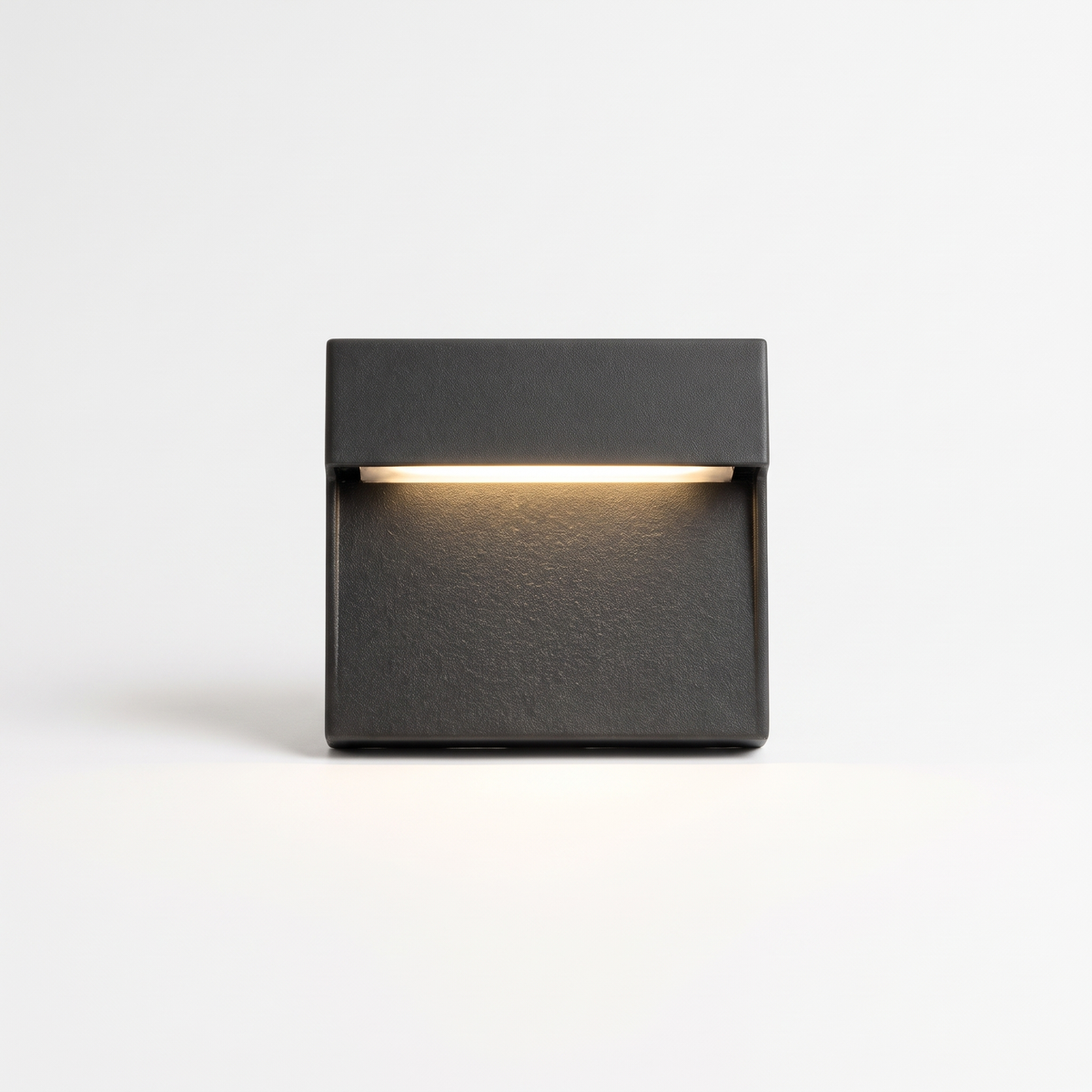 Ames LED outdoor step light, a square black aluminium wall mounted stair light, on a white background