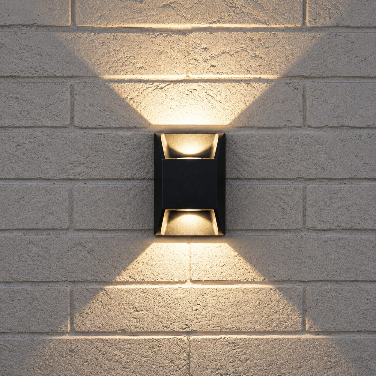 Ava Metal Outdoor Wall Light in the 12cm size mounted on an exterior wall