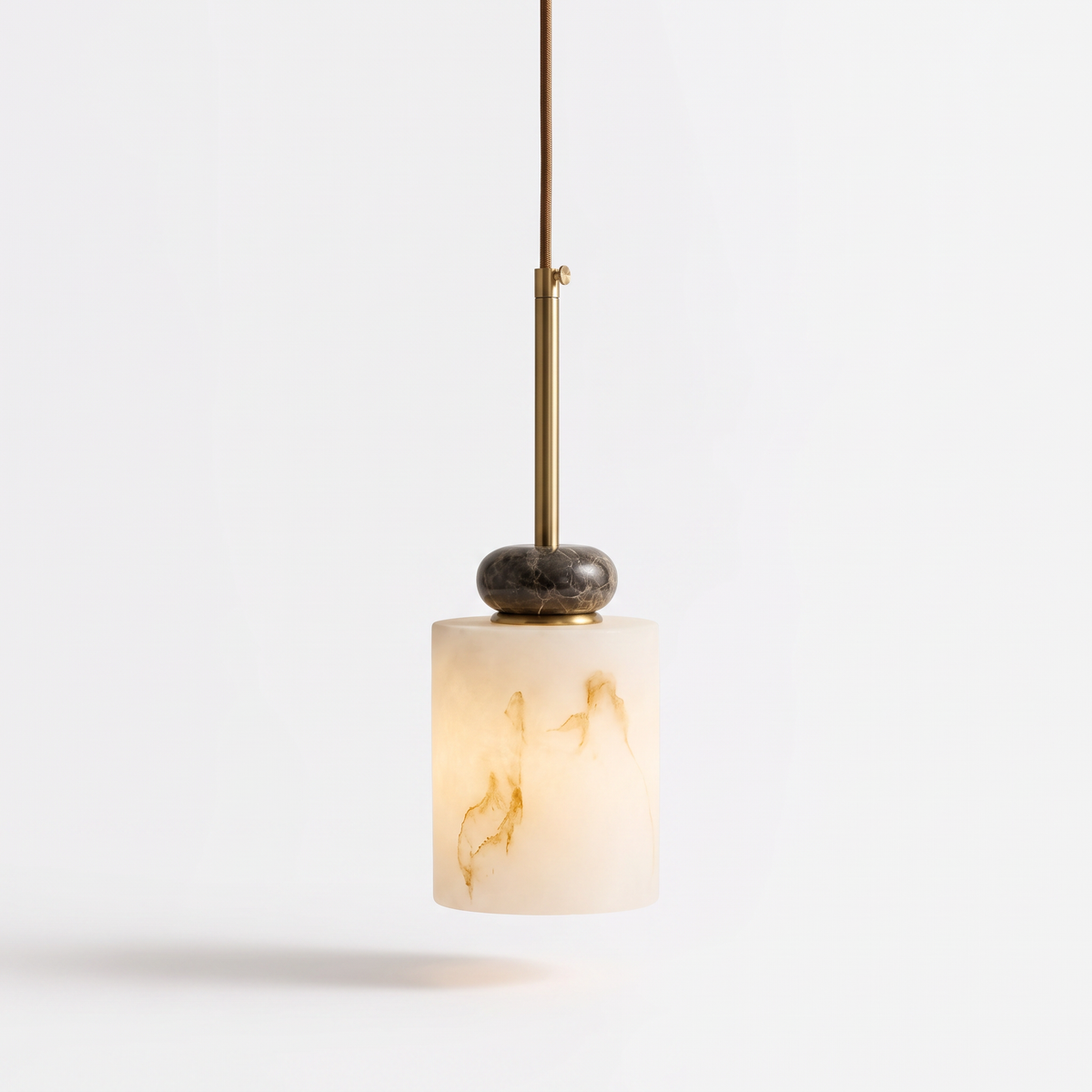 Banyjima Model B faux alabaster cylinder pendant with a dark marble bead on a white background