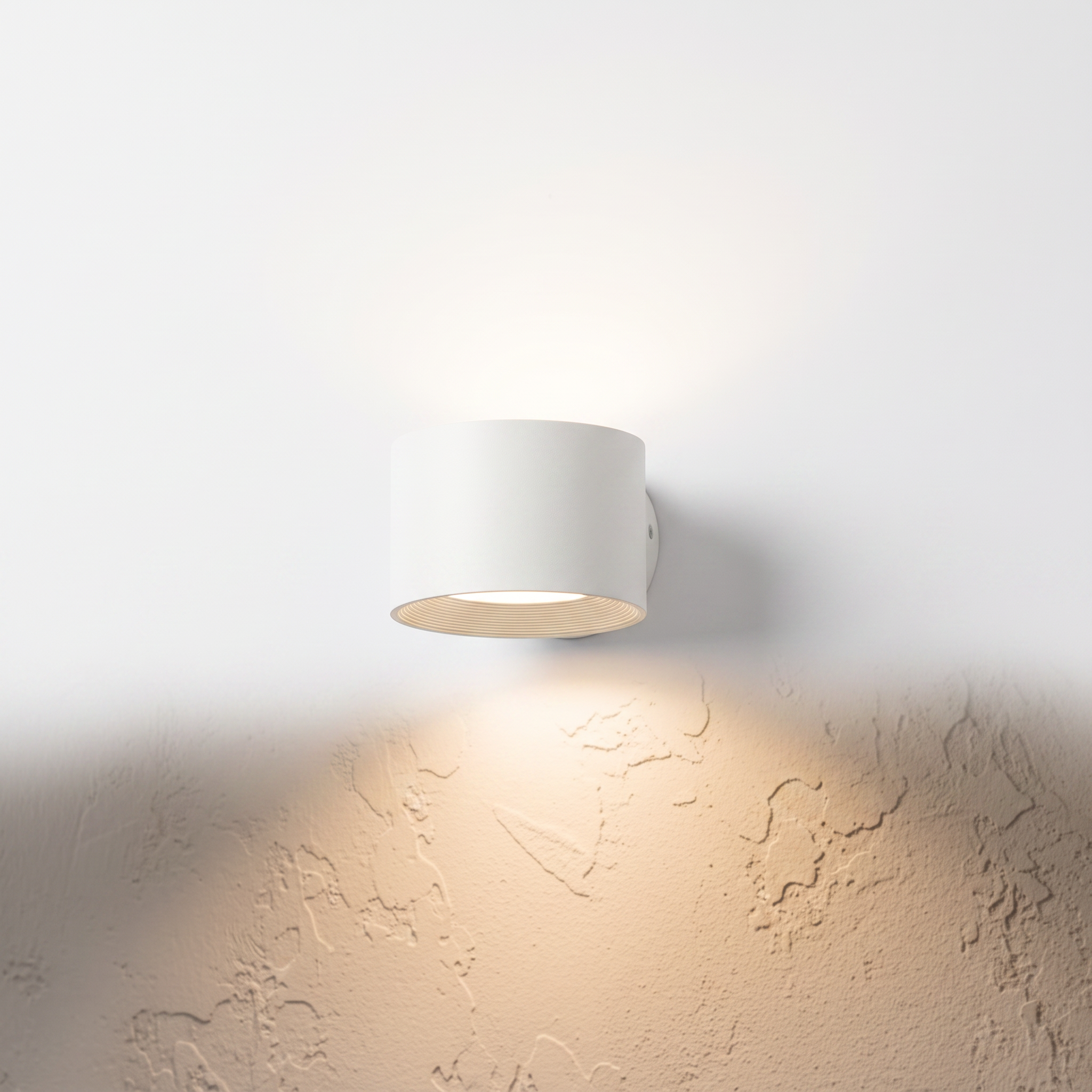 Belmont dual-direction LED wall sconce in white on a white background