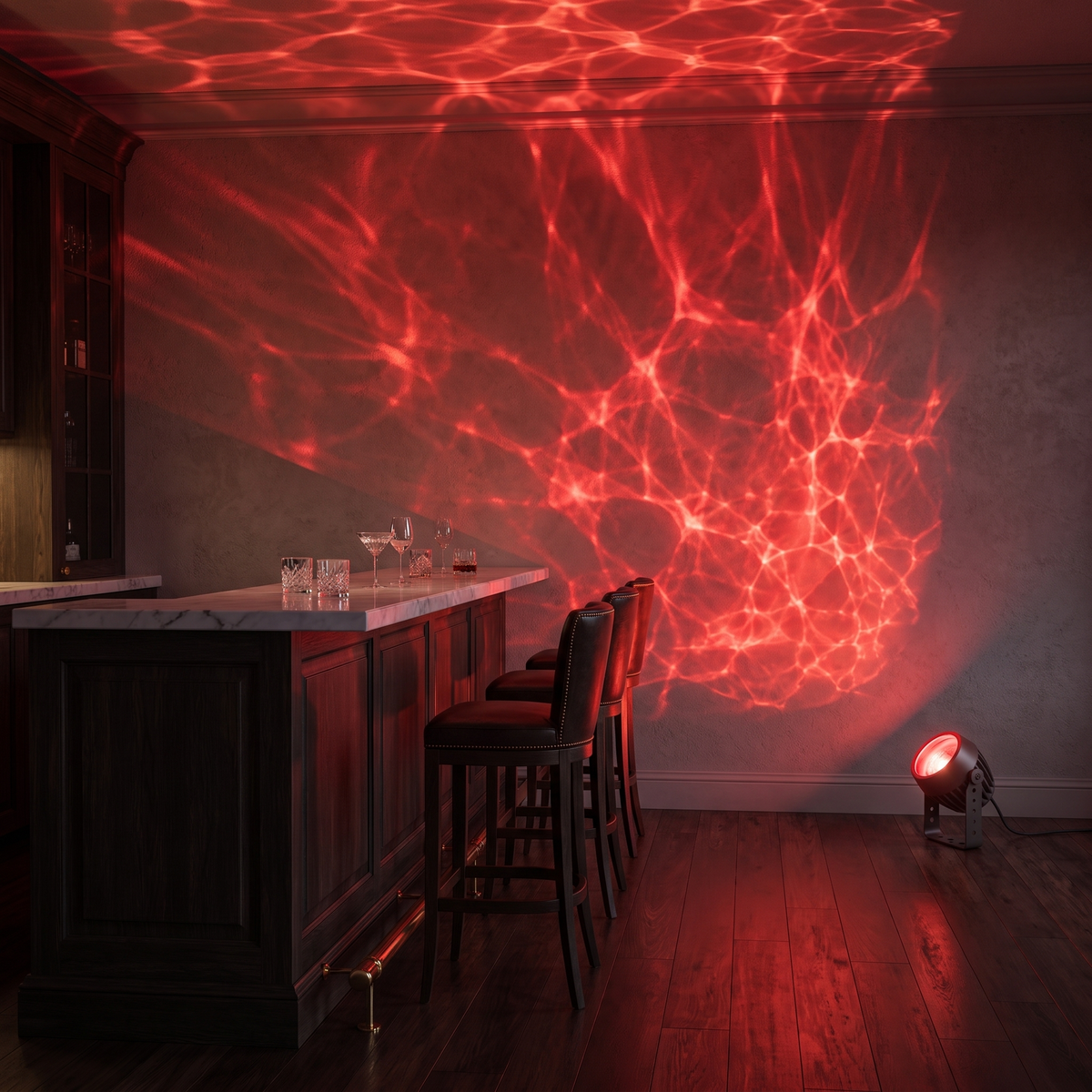 Beso water ripple spotlight projecting a red ripple effect across a home cocktail bar
