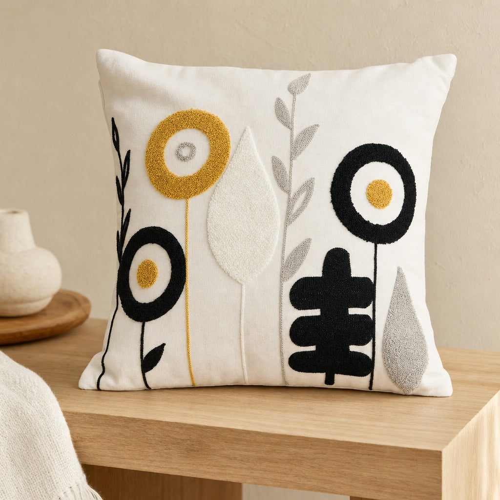 Close view of the Blossoms tufted floral cushion cover on an oak bench showing raised texture