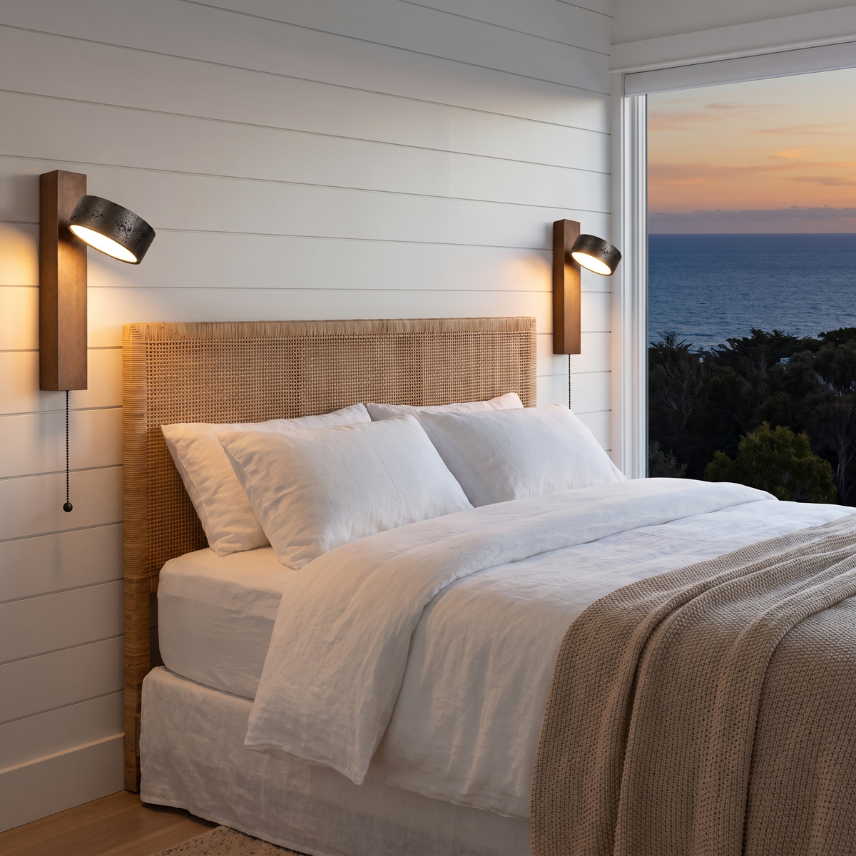 Pair of Boa pull chain wall sconces as bedside reading lights in a coastal bedroom