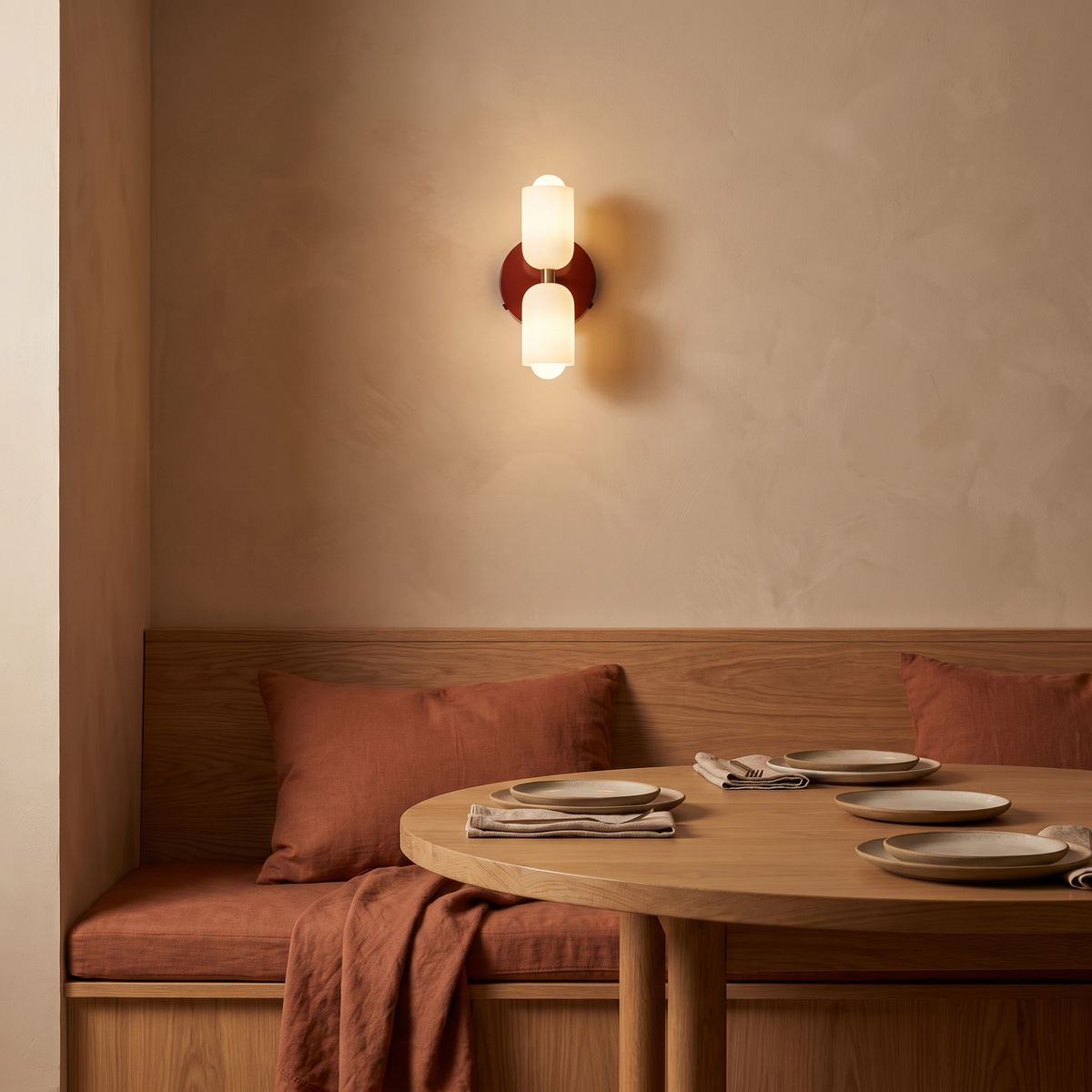 Boni up and down wall light in red in a dining nook